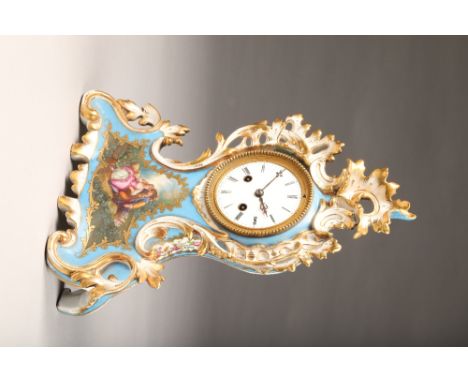 Late 19th Century French painted and gilded porcelain clock. Eight day movement striking on a bell, case decorated with flora