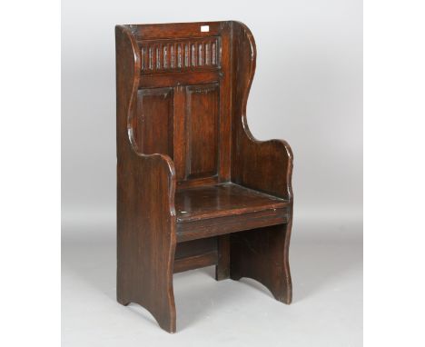 A 20th century Jacobean Revival stained oak hall bench, height 115cm, width 59cm, depth 43cm.Buyer’s Premium 29.4% (including