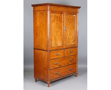 A George V mahogany and ebony inlaid linen press with reeded corner pillars, height 203cm, width 126cm, depth 62cm.Buyer’s Pr