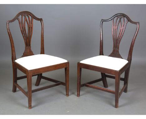 A set of ten George III pierced splat back dining chairs with drop-in seats, height 97cm, width 53cm (faults and repairs).Buy