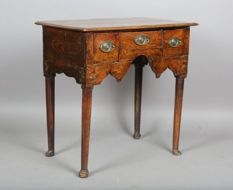 An 18th century and later elm lowboy, fitted with frieze drawers, height 78cm, width 79cm, depth 49cm (alterations).Buyer’s P