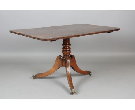 A Regency mahogany and rosewood crossbanded tip-top breakfast table, on downswept tripod legs, height 70cm, length 127cm, dep