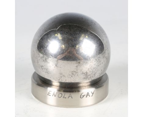 A 5cm diameter steel ball bearing and stand, purportedly from the Enola Gay Boeing B-29 Superfortress bomber, the circular st