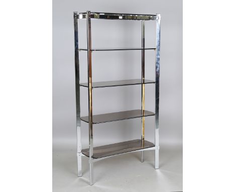 A mid-20th century chromium plated five-tier display shelf, fitted with smoky glass shelves, height 176cm, width 92cm, depth 