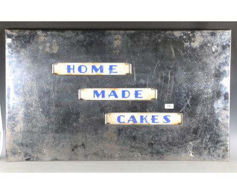 An Art Deco chromium plated 'Home Made Cakes' sign, inset with glazed white marble panels, height 57cm, width 96cm.Buyer’s Pr