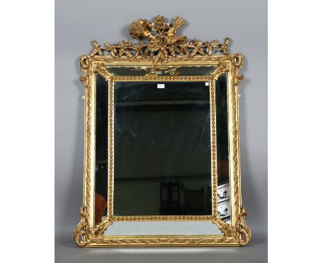 A 19th century gilt composition sectional wall mirror with a bird and quiver surmount above a beaded and foliate scroll frame