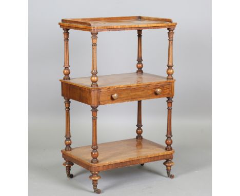 A Victorian walnut three-tier whatnot, height 96cm, width 58cm, depth 38cm.Buyer’s Premium 29.4% (including VAT @ 20%) of the