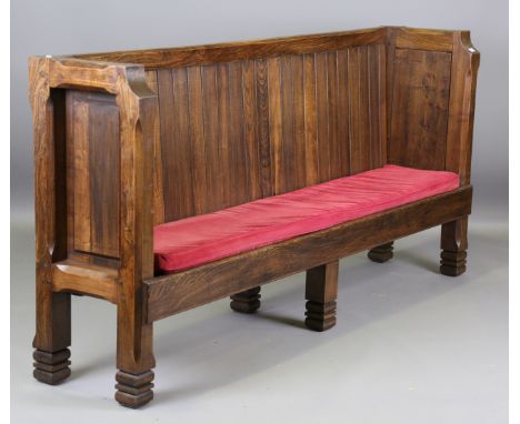 A large mid-20th century elm panelled back settle with chamfered corners, height 112cm, width 240cm, depth 48cm.Buyer’s Premi