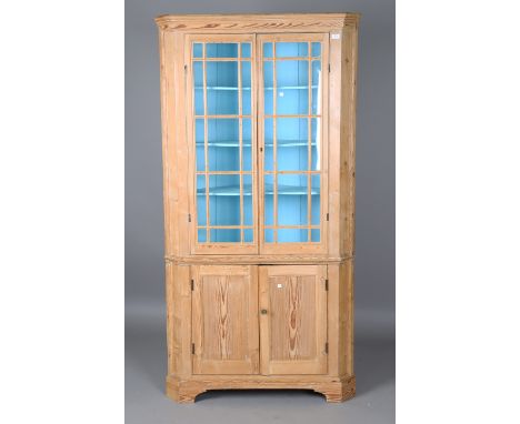 A George III pine floor-standing corner cupboard, the interior painted in sky blue, height 199cm, width 104cm, depth 54cm.Buy