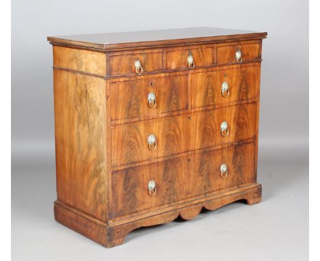 A 19th century French figured mahogany chest of drawers, the mahogany-lined drawers with applied brass lion's mask handles, h