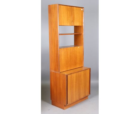 A mid-20th century G-Plan teak four-section wall unit, comprising a shelf, two cabinets and a chest, height 199cm, width of e