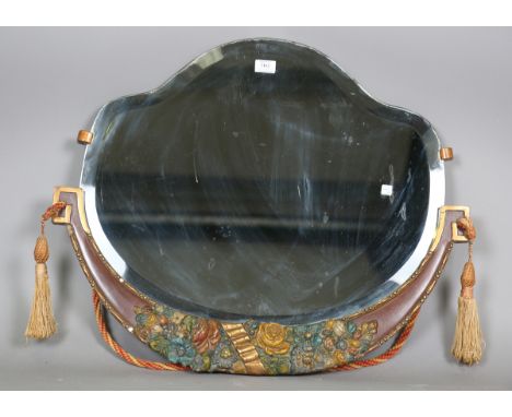 An Art Deco shaped wall mirror with a painted and carved floral apron, 64cm x 76cm.Buyer’s Premium 29.4% (including VAT @ 20%