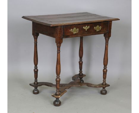 A William and Mary oak side table, the three-piece moulded edge top above a single drawer, the turned legs united by a shaped