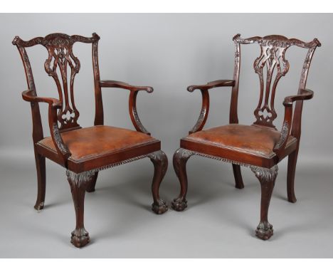 A set of eight early/mid-20th century George III Chippendale style mahogany dining chairs with finely carved backs and leathe