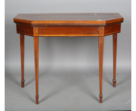 A George III mahogany fold-over card table with satinwood crossbanding, height 73cm, width 94cm, depth 46cm (faults).Buyer’s 