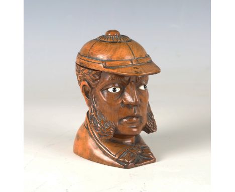 A mid-Victorian carved boxwood novelty inkwell, finely modelled as the head of a gentleman wearing a hat and inset with glass