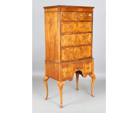 An early 20th century Queen Anne style walnut chest-on-stand, fitted with an arrangement of oak-lined drawers, height 172cm, 