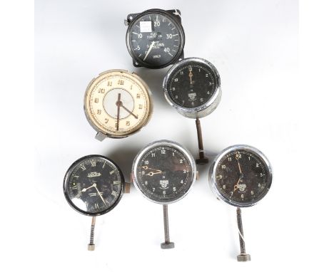 A Jaeger eight day automobile dashboard clock and a small collection of mainly Smiths dashboard clocks, fuel and oil gauges.B