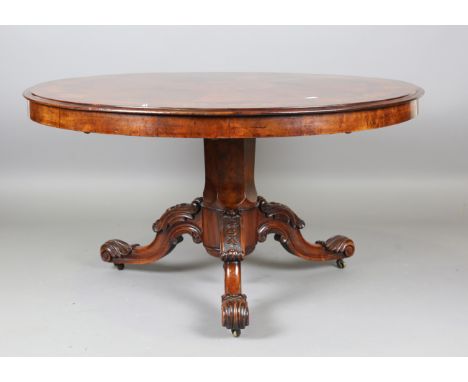 A mid-Victorian burr walnut and floral marquetry inlaid circular tip-top breakfast table, raised on a finely carved tripod ba