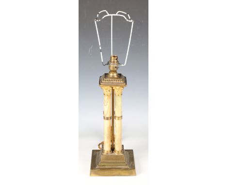 An early 20th century Neoclassical Revival gilt metal and banded onyx cluster column table lamp, height 37cm.Buyer’s Premium 