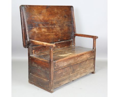 A 19th century provincial fruitwood and pine monk's bench, the hinged top above a box seat, height 74cm, width 124cm, depth 6