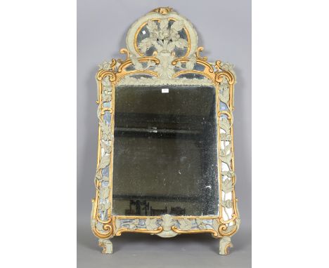 A 19th century Continental green painted and gilded wall mirror, the shaped crest carved with a floral surmount, 145cm x 82cm