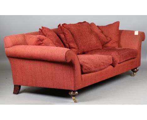 A large modern sofa, upholstered in claret fabric, raised on gilt metal mounted feet and castors, height 83cm, width 240cm, d