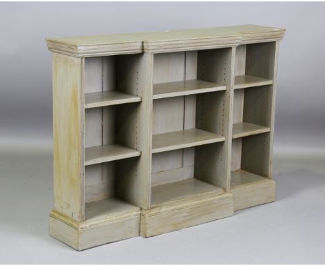 An early 20th century green painted breakfront open bookcase, height 97cm, width 133cm, depth 31cm.Buyer’s Premium 29.4% (inc