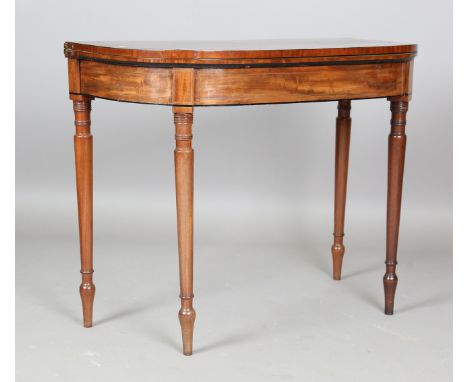 A George IV mahogany fold-over card table, the frieze with ebony stringing, height 74cm, width 91cm, depth 44cm.Buyer’s Premi