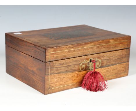 A Regency rosewood and brass inlaid workbox with a silk-lined interior, containing several implements, width 28cm.Buyer’s Pre
