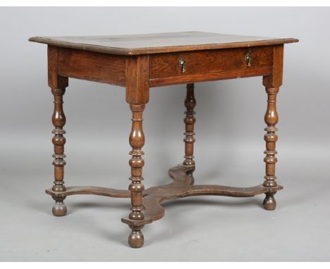 A William &amp; Mary oak side table, fitted with a single drawer, the legs united by a shaped 'X' stretcher, height 71cm, wid