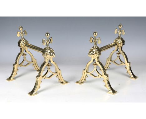 A pair of late Victorian Aesthetic Movement brass fire tool rests, in the manner of Dr Christopher Dresser, possibly made by 