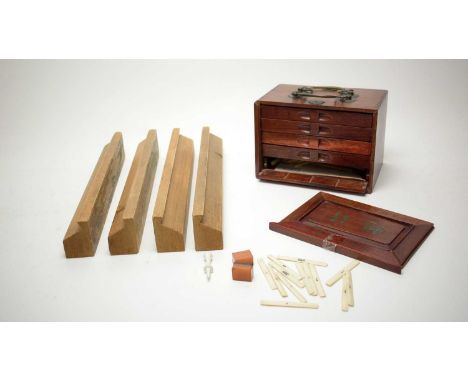 A Mahjong set, in travel case (damages).