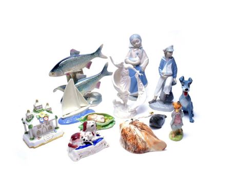 A selection of decorative ceramics, including: Lladro figure of a boy with sailing boat; Wade tramp dog figure; Beswick Beatr