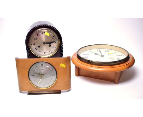 An Ernest W. Gibbins London wall clock, 32cms diameter; together with a Metamec mantel clock; and a dome-cased mantle clock. 