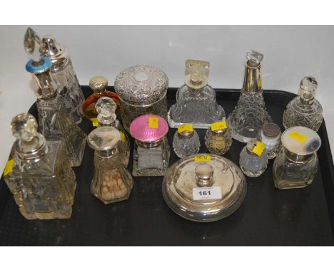 A selection of silver mounted cut glass dressing tables bottles, two with enamel decoration. 