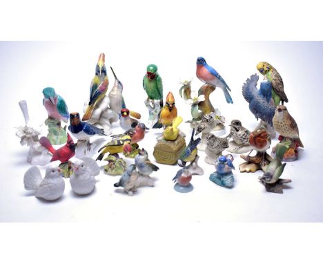 A selection of ceramic figures of birds, including: Crown Staffordshire blanc de chine bird figure by J.T. Jones; Royal Worce