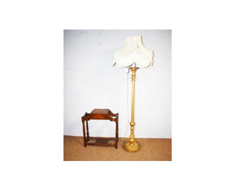 An Edwardian oak stick stand, 59 x 24 x 67cms high: and a gold painted lamp standard with tasselled shade, 185cms high.(2)