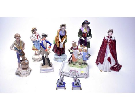 A selection of decorative ceramic figures, including: Royal Worcester Royal Commemorative figure of Queen Elizabeth II, in ce