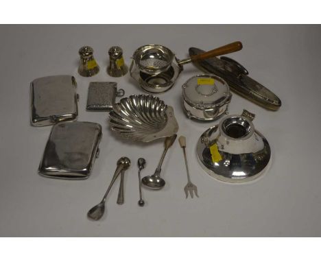 A selection of silver items, to include: two cigarette cases; a vesta case; a tea strainer on stand; shell pattern butter dis