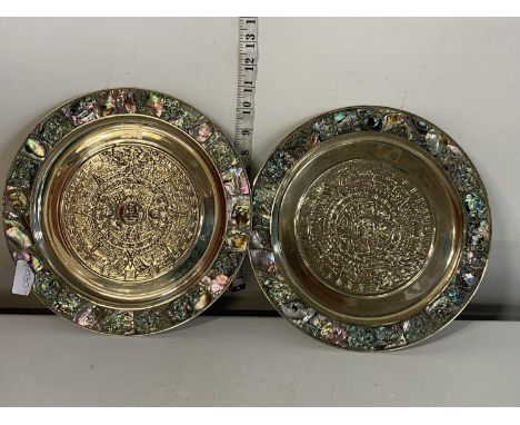 A unusual pair of Aztec themed abalone shell plates D28cm 