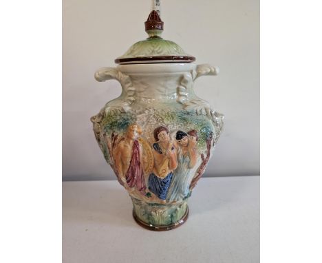 A large Victorian Capodimonte porcelain lidded urn. Decorated with the Green Man on either side and with figural detailing. 4