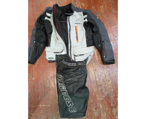 A Hein Gericke motorbike jacket size L with a pair of leather Dainese pants size 46 