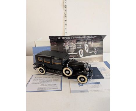 A boxed Franklin Mint Al Capones armoured Cadillac model 1/24 scale 