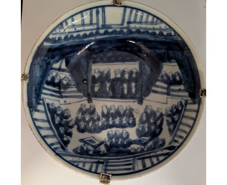 A blue and white Tianqi period shallow bowl depicting a large gathering of Buddhist monks. The exterior is decorated with dou