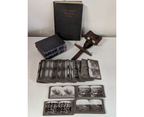 A antique stereoscope and a large collection of approx 100 WW1 related cards with a WW1 photographic book 