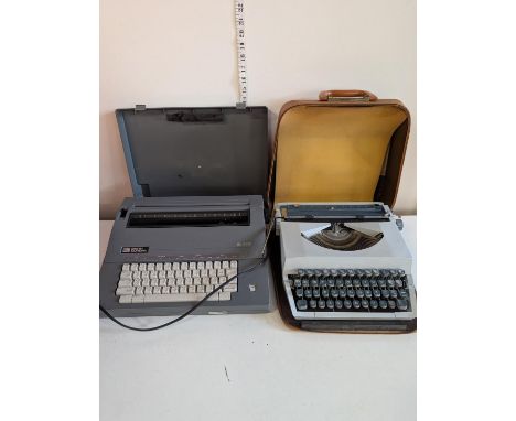 A typewriter in case and Smith Corona word processor untested 