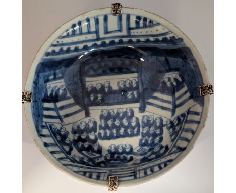 A blue and white Tianqi period shallow bowl depicting a large gathering of Buddhist monks. The exterior is decorated with dou