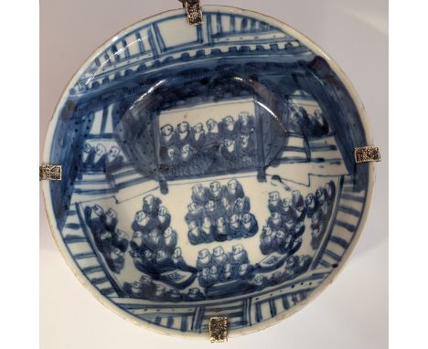 A blue and white Tianqi period shallow bowl depicting a large gathering of Buddhist monks. The exterior is decorated with dou