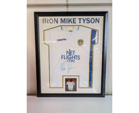 A framed Leeds United football shirt signed by Mike Tyson 97x80cm 